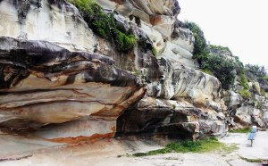 b The sandstone makes a colorful medium for sculpting by wind and water.