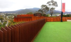 This is the courtyard just outside the entrance. The wind was blowing  which caused the  flat metal fence posts to hum a harmonica-like tune.