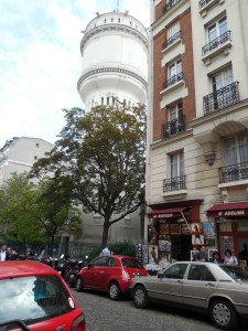 The large cylindrical building is Eau de Paris - in English, it's the Paris water tower. A pretty fancy water tower.