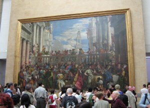 Lots of people enjoying the art and atmosphere.