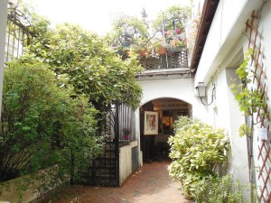 Small courtyards were wedged behind shops with stairs leading to more apartments.