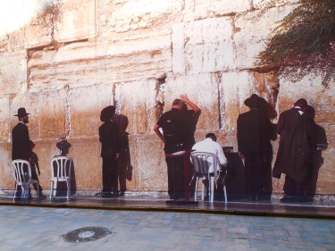 The screen over the renovation site next to the Grand Choral Synagogue depicts the Western Wall/Wailing Wall in old Jerusalem.