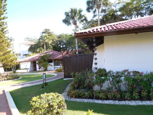 Our room is in the small cabana to the left. The little chain of flowerpots down the side of the corner of the building is actually a downspout. Water flows from the gutters and through the little bottomless pots.