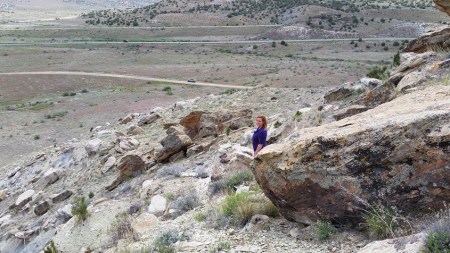 Traci hunting for the cache. You may notice, if you look really closely, our tiny little car on the road way down the mountain. Sadly we didn't find this one - bummer!